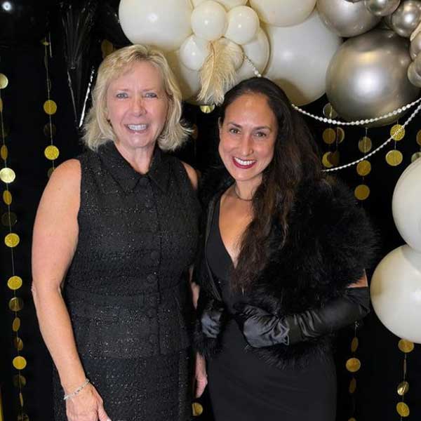 2 women Julia Parton and Andrea Lastimosa attend fundraising event