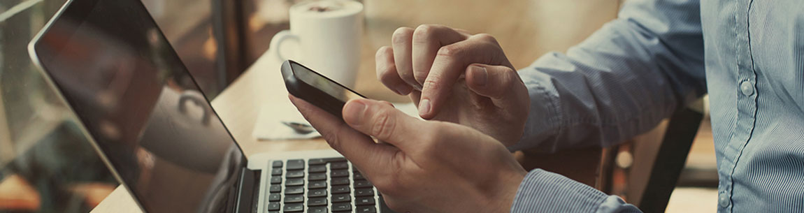 man holding a cell phone to access the internet.