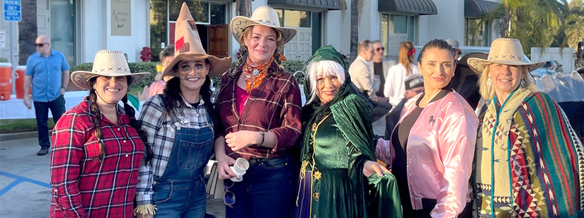 malaga staff wearing halloween costumes at the fundraiser