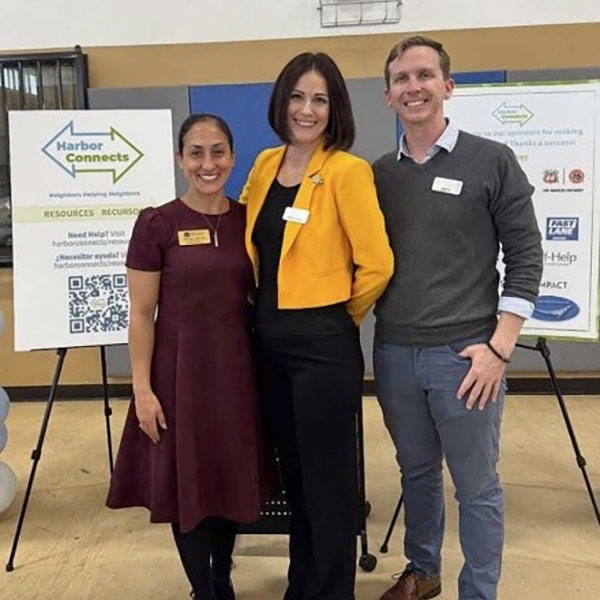 two women and a man at the harbor connects event