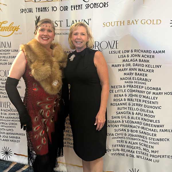 two women dressed in twenties flapper attire