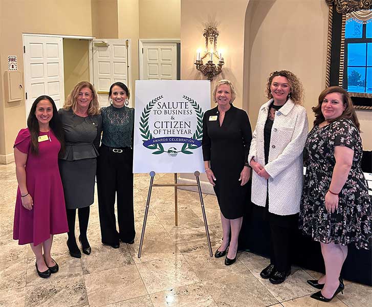a group of women attending a gala event