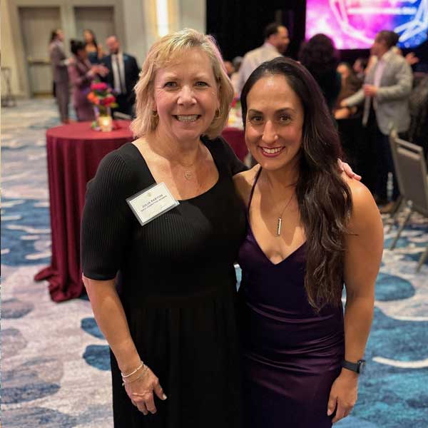2 women in formal dresses