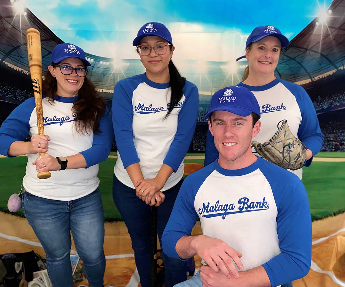 group dressed in baseball uniforms