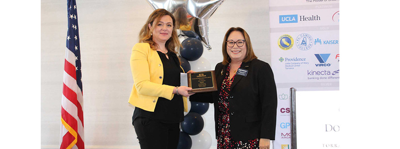 ana straser accepting an award