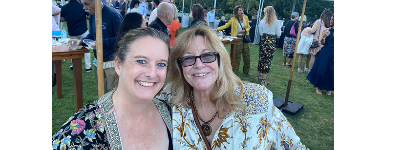2 women, Sacha Ohara and Tara Nierhausen, smiling at an afternoon fundraiser