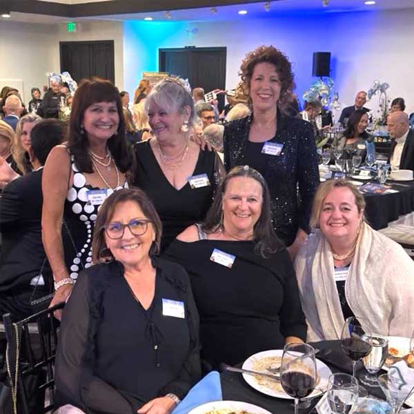 women at the Malaga Bank table