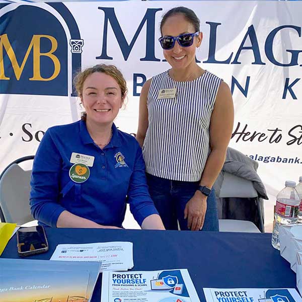 2 women from malaga bank at event