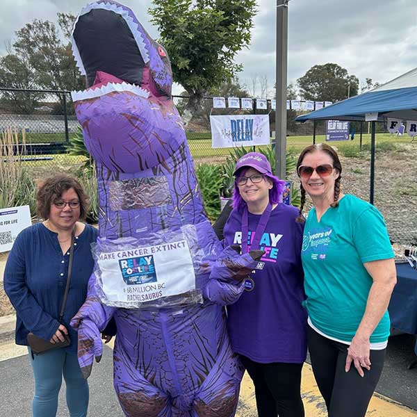 women and purple dinosaur at San Pedro Relay for Life