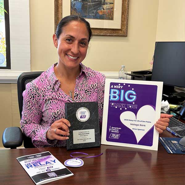 Andrea Lastimosa holding thank you card